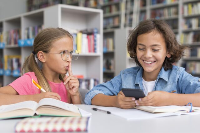 girl-shushing-boy-library